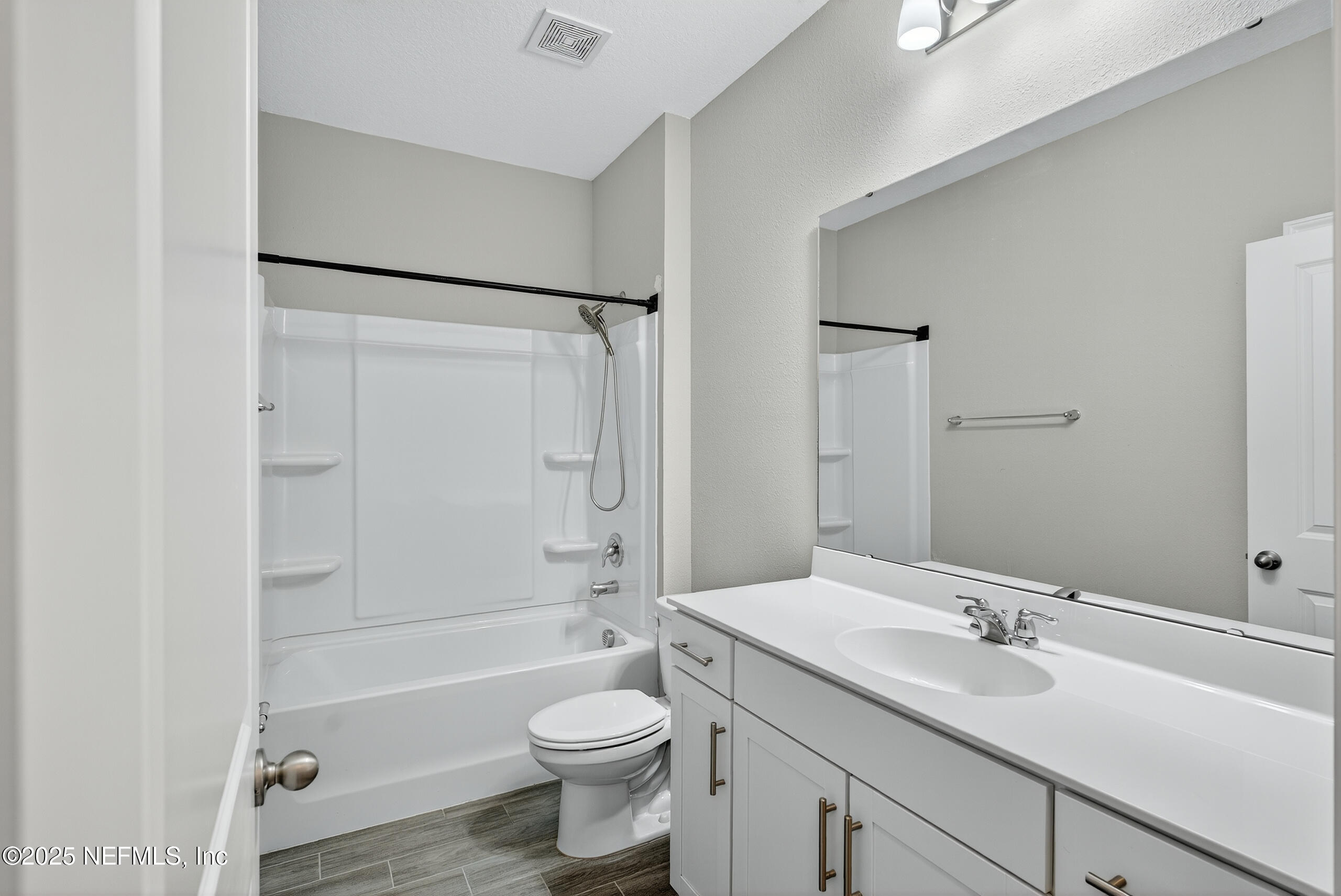 75598 Blackbird Drive Yulee, FL 32097 - Photo 25 of 30 a bathroom with a sink toilet and shower