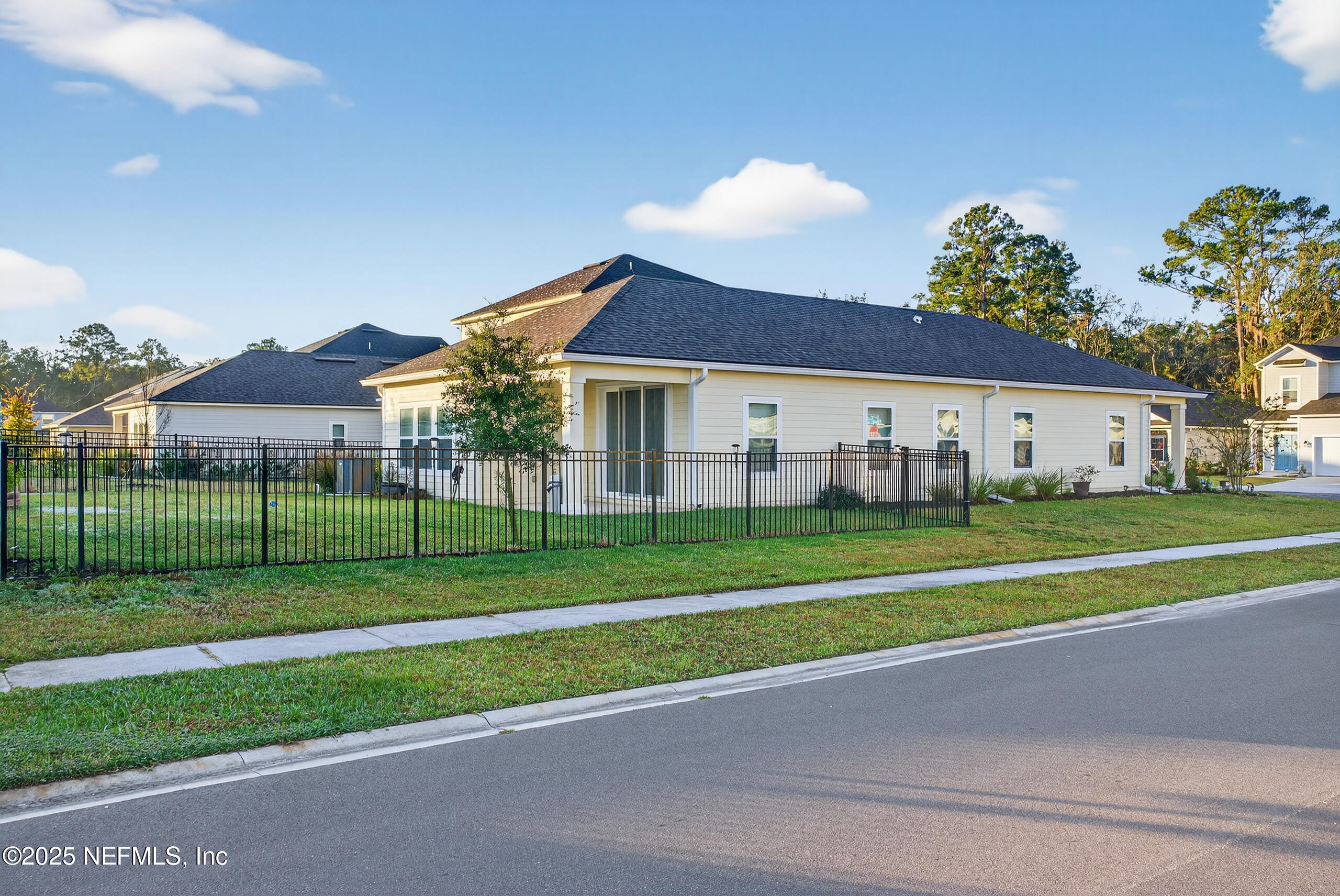 75598 Blackbird Drive Yulee, FL 32097 - Photo 29 of 30 a view of a house with a big yard and potted plants