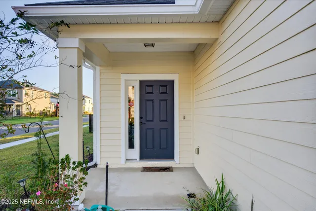 a view of a hallway with front door