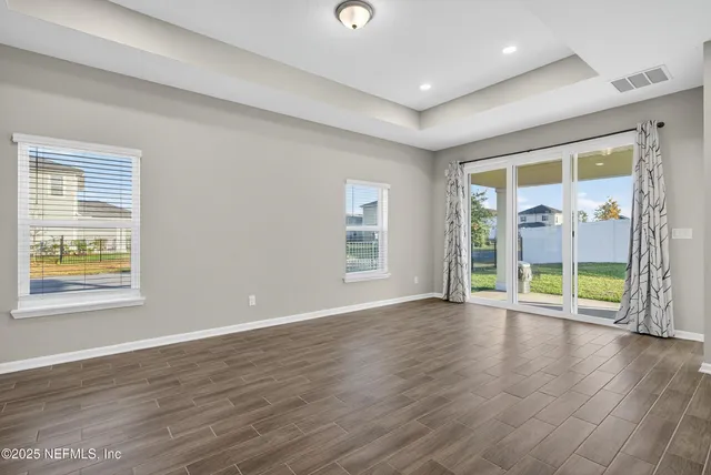 a kitchen with kitchen island cabinets and refrigerator