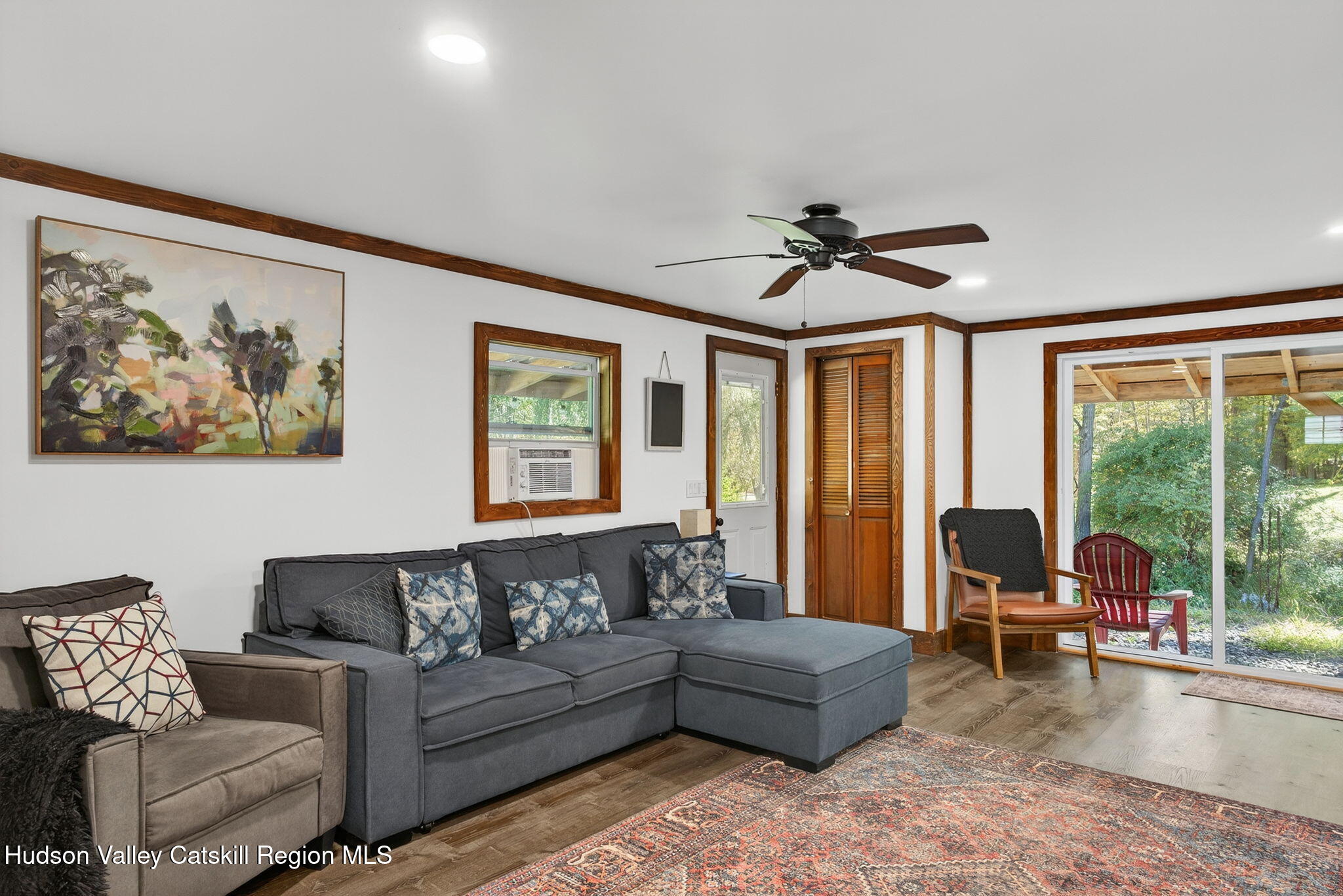 40 Paddock Road East Durham, NY 12423 - Photo 22 of 61 a living room with furniture and a large window