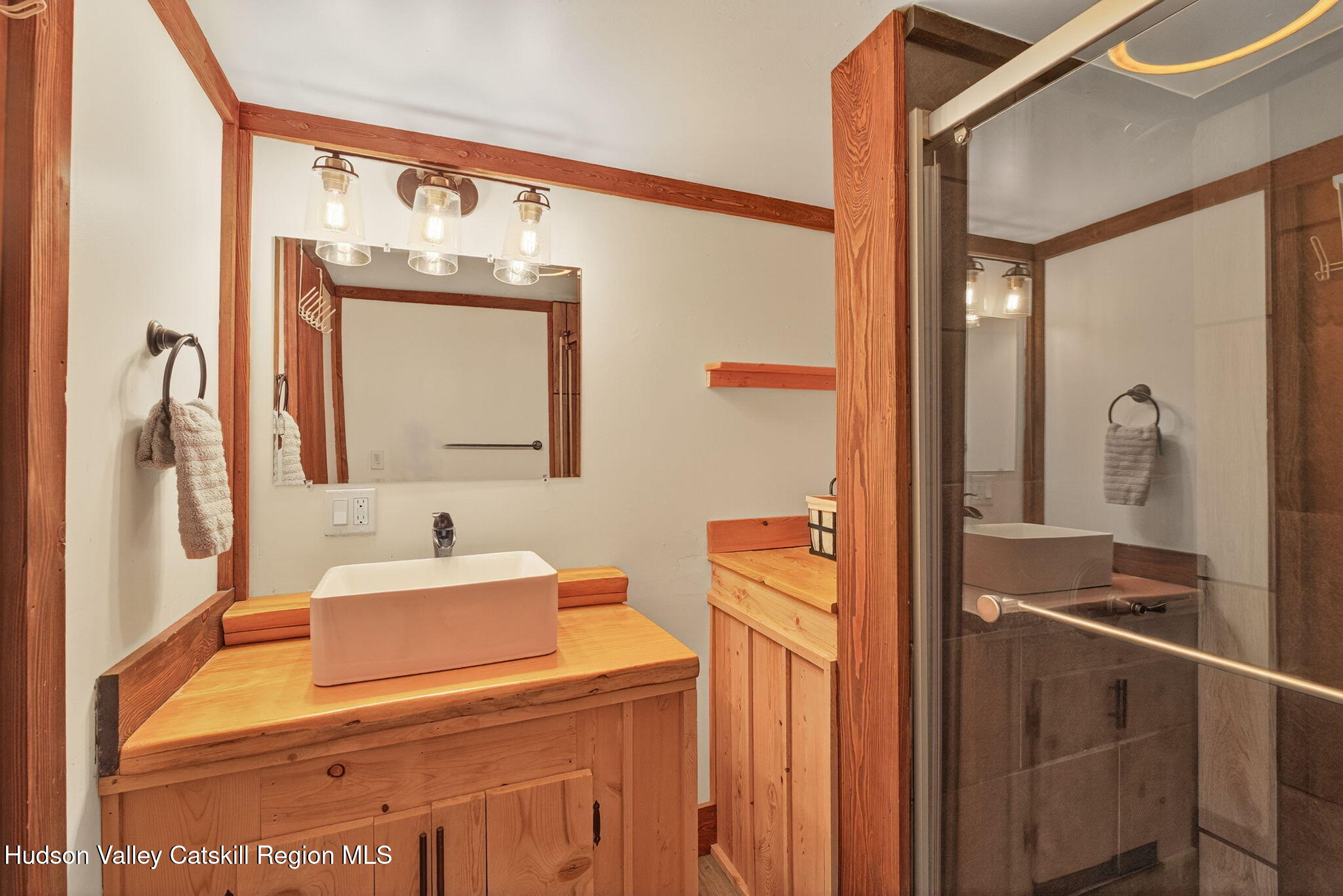 40 Paddock Road East Durham, NY 12423 - Photo 23 of 61 a bathroom with a sink a mirror and a shower