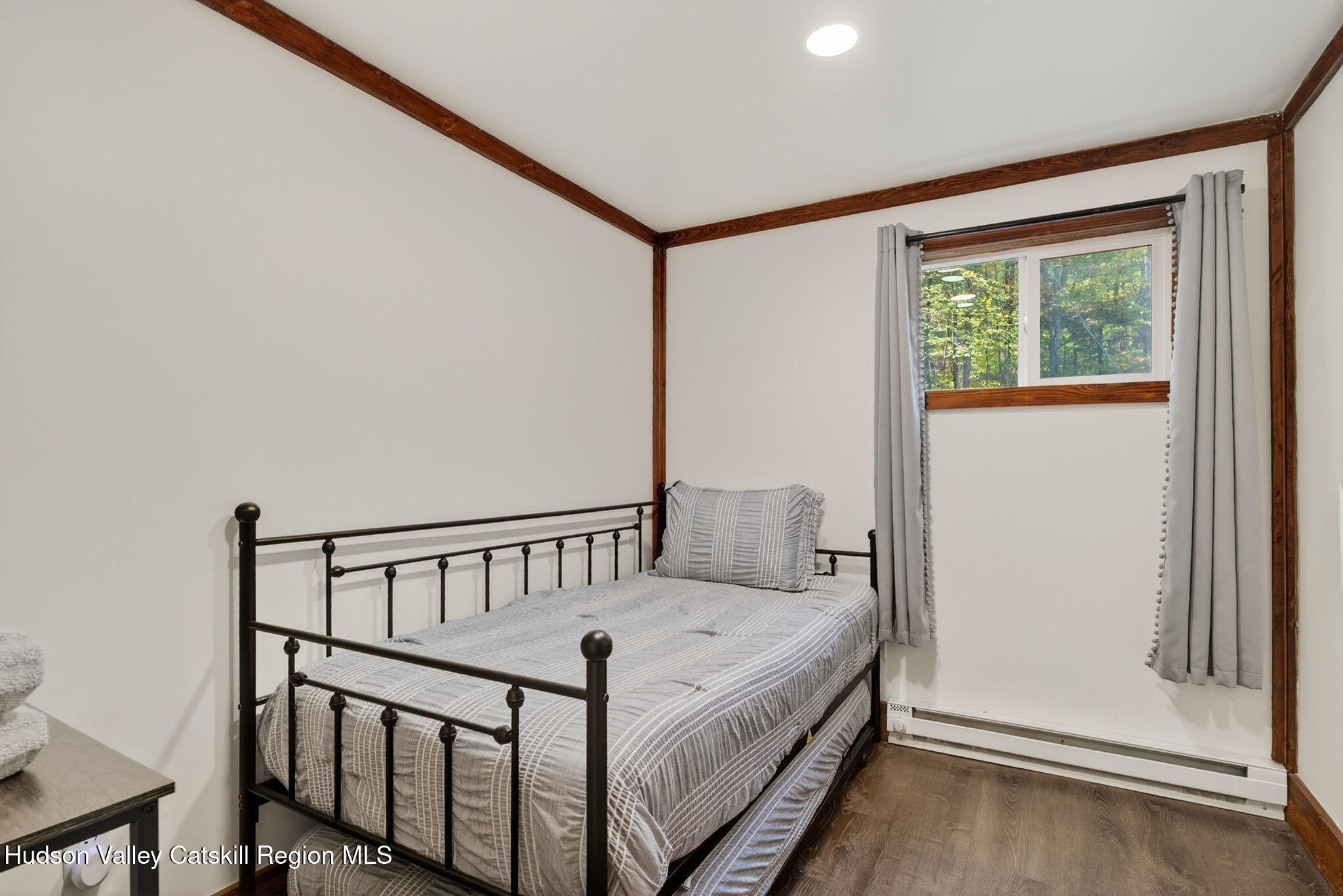 40 Paddock Road East Durham, NY 12423 - Photo 24 of 61 a view of a bedroom with wooden floor and a window