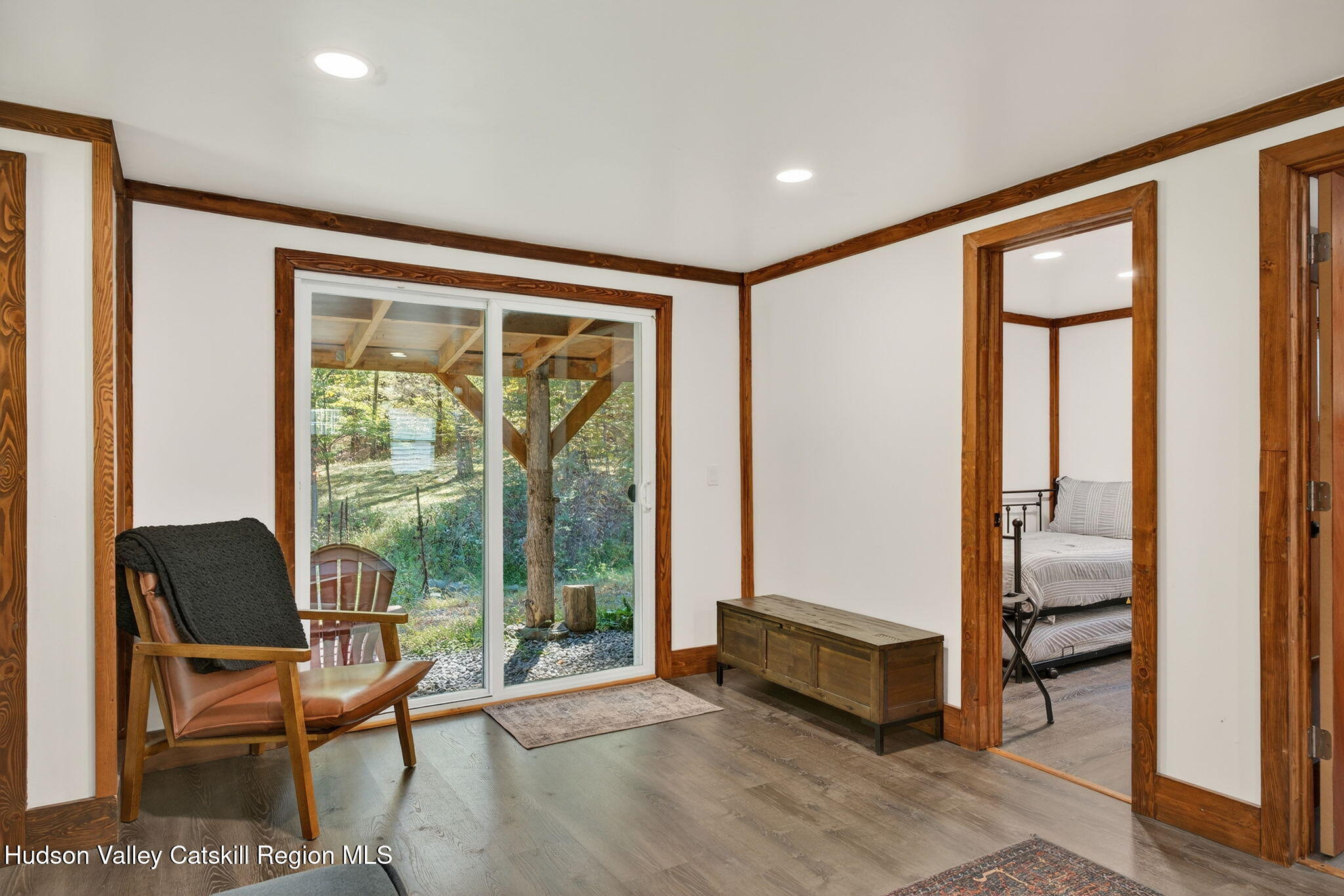40 Paddock Road East Durham, NY 12423 - Photo 26 of 61 a spacious bedroom with a large window and a chair