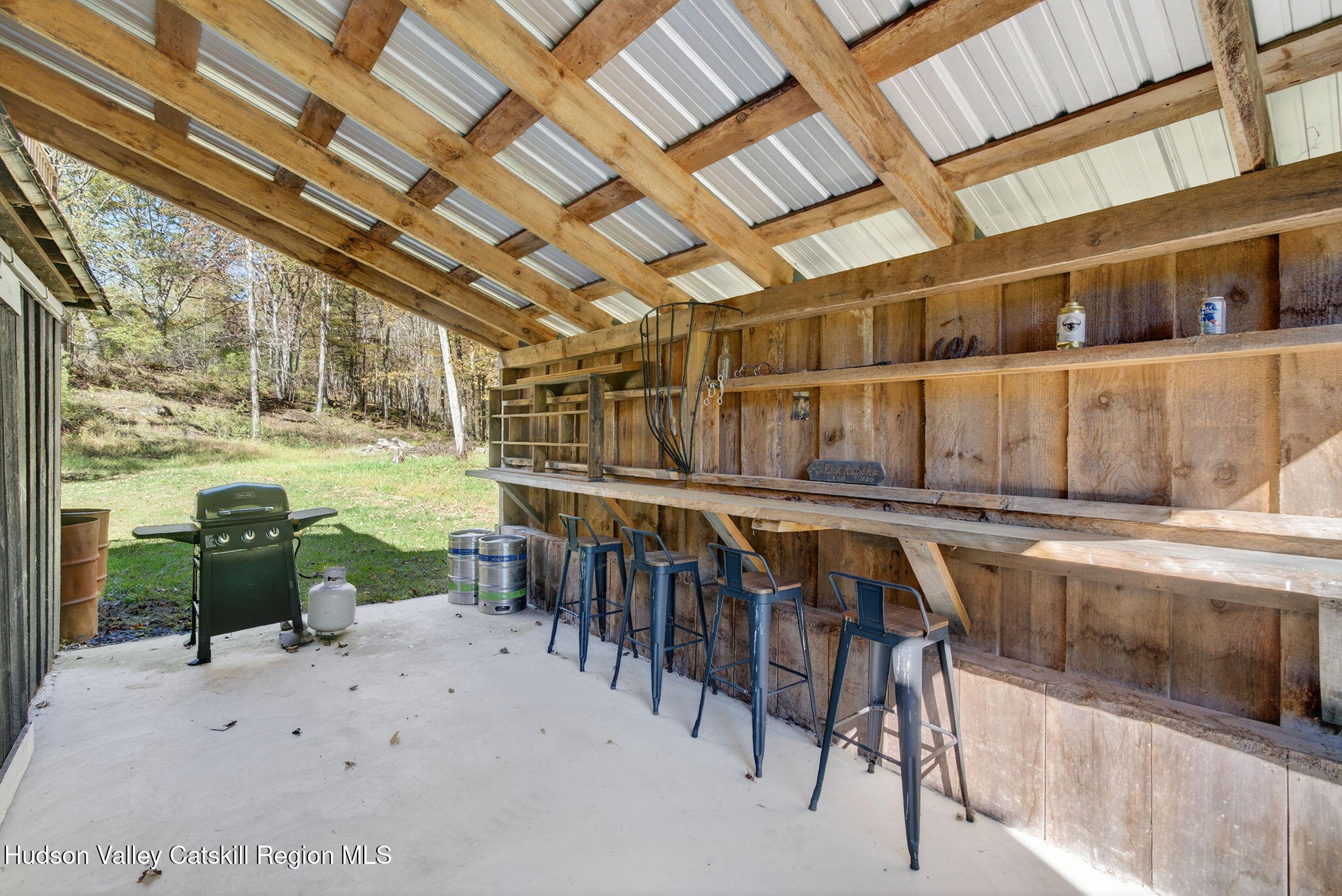 40 Paddock Road East Durham, NY 12423 - Photo 36 of 61 a view of a chairs and table in patio