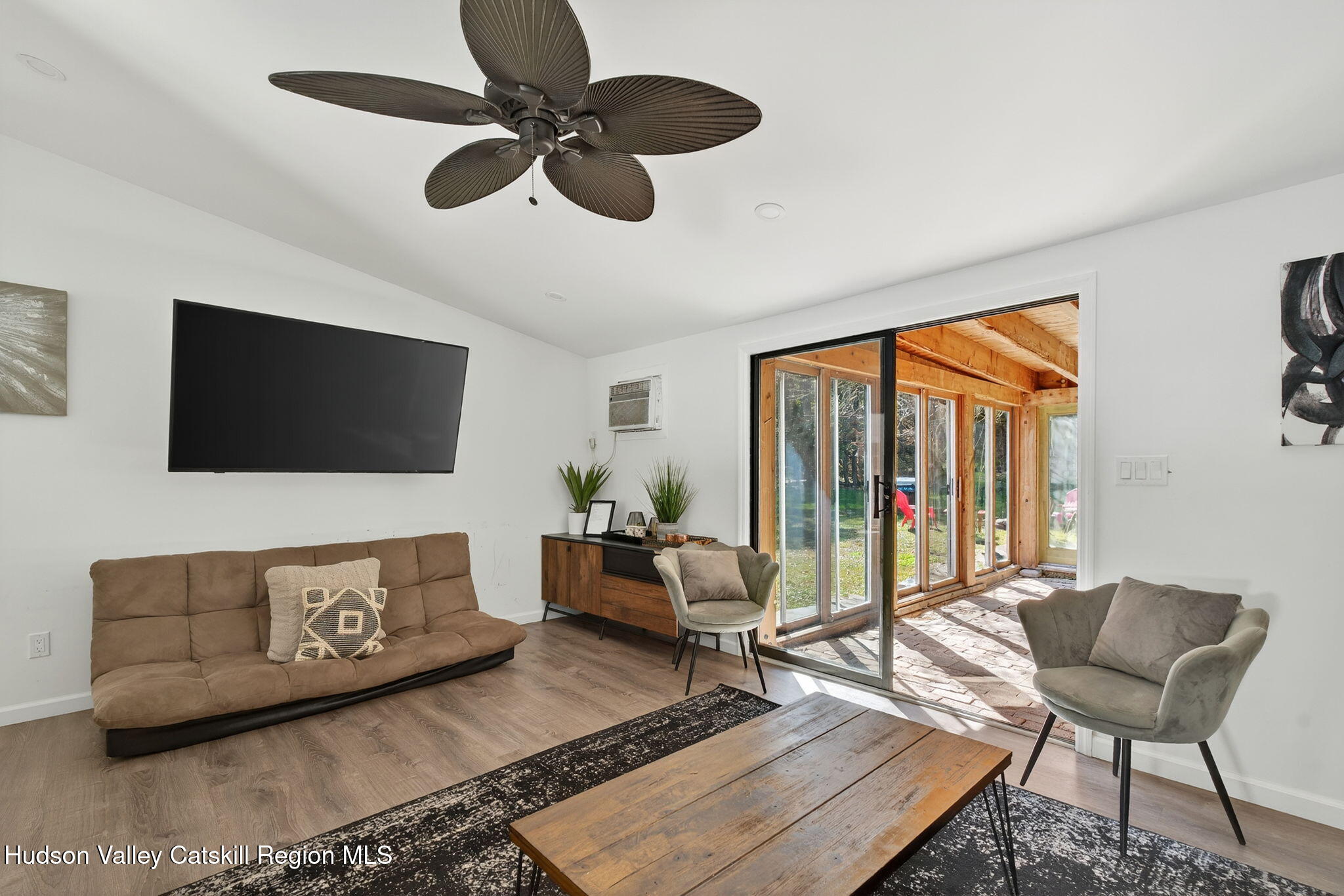 40 Paddock Road East Durham, NY 12423 - Photo 10 of 61 a living room with furniture and a flat screen tv