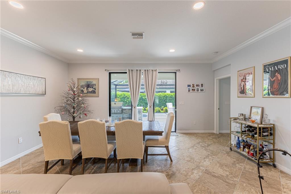 9231 Shadow Oak Lane Naples, FL 34120 - Photo 13 of 46 a view of a dining room with furniture window and outside view