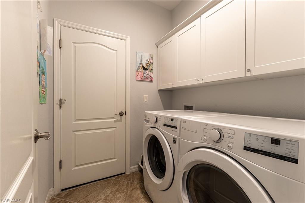 9231 Shadow Oak Lane Naples, FL 34120 - Photo 35 of 46 a utility room with dryer and washer