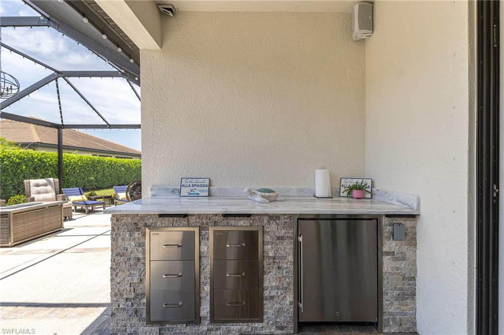 9231 Shadow Oak Lane Naples, FL 34120 - Photo 36 of 46 a view of a kitchen with furniture and window
