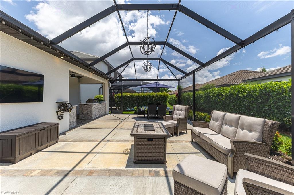 9231 Shadow Oak Lane Naples, FL 34120 - Photo 39 of 46 a outdoor space with lots of tables and chairs