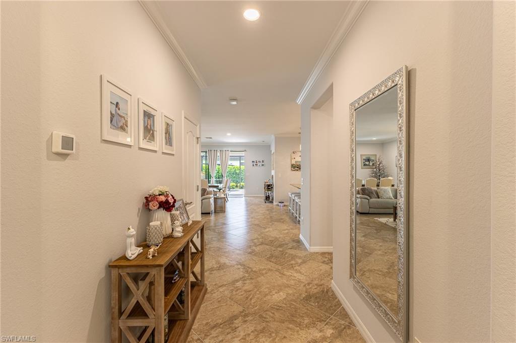 9231 Shadow Oak Lane Naples, FL 34120 - Photo 9 of 46 a view of a hallway with workspace