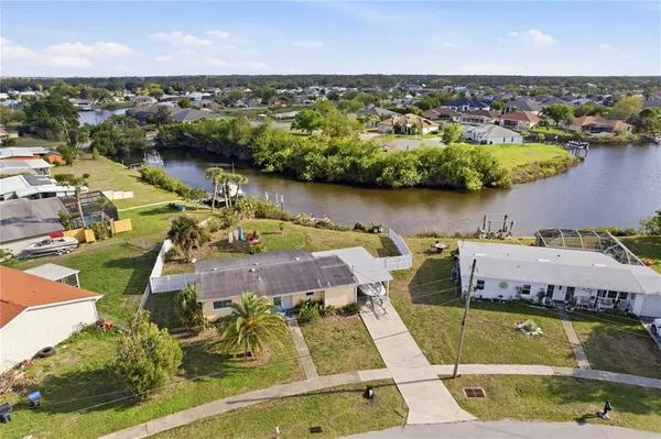 an aerial view of a house with a swimming pool