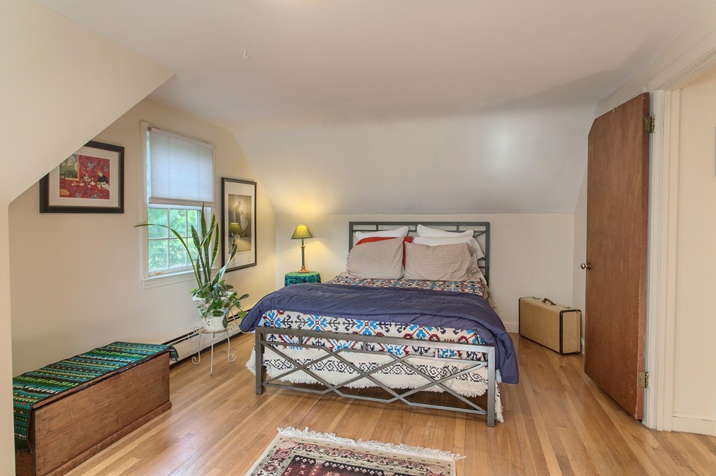 814 Langen Road Lancaster, MA 01523 - Photo 22 of 30 a bedroom with a bed and wooden floor