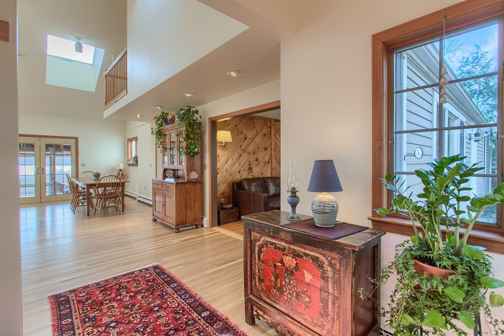 814 Langen Road Lancaster, MA 01523 - Photo 4 of 30 a living room with fireplace furniture and a potted plant
