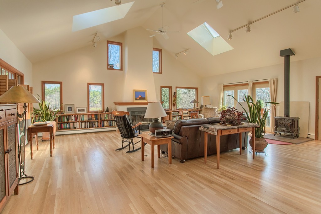 814 Langen Road Lancaster, MA 01523 - Photo 5 of 30 a living room with lots of furniture and wooden floor