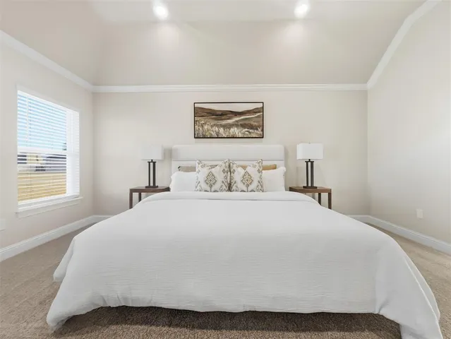 a bedroom with a bed and a lamp