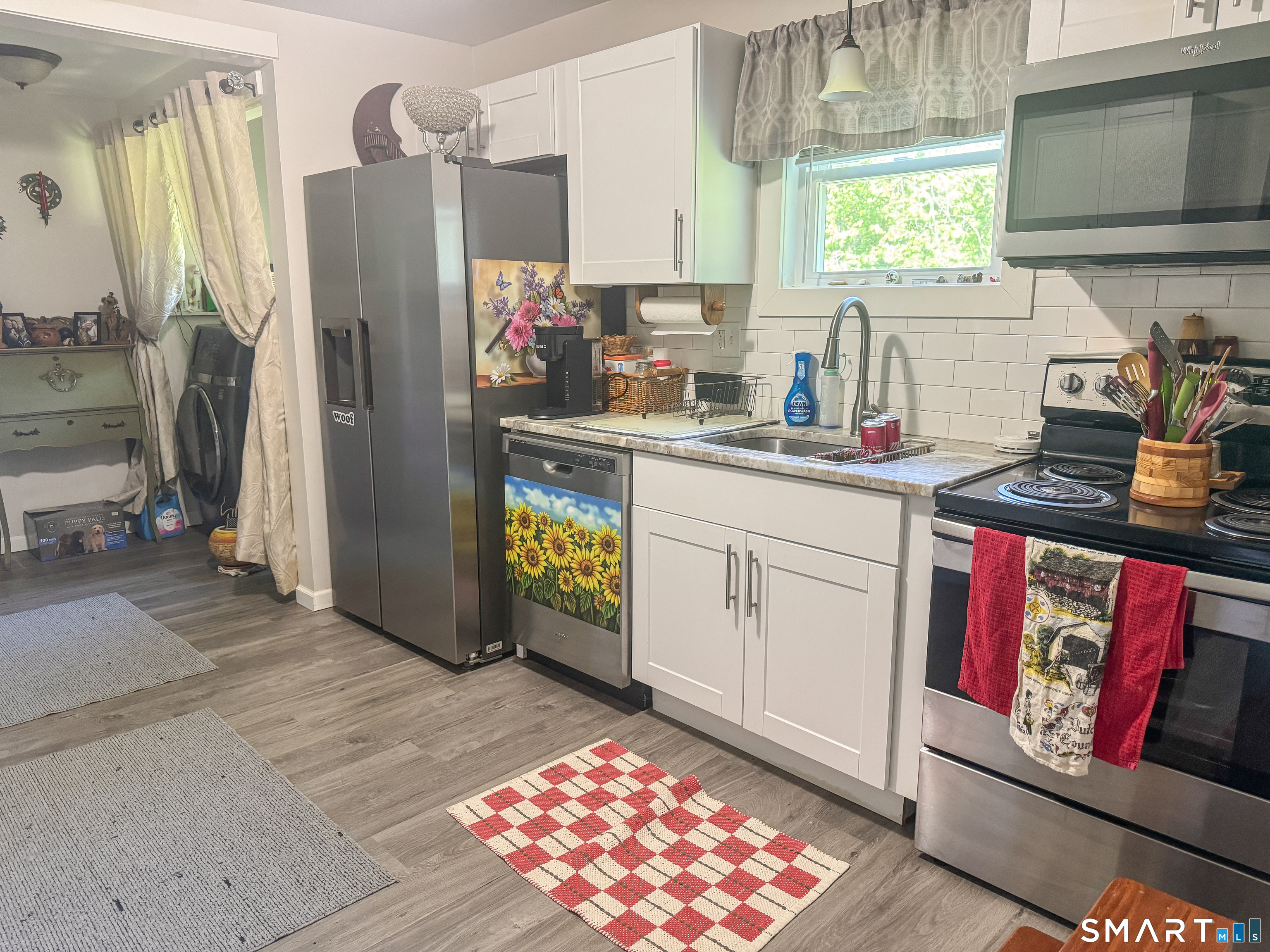 36 Jennings Street Norwich, CT 06360 - Photo 18 of 33 a kitchen with stainless steel appliances granite countertop a refrigerator sink and stove