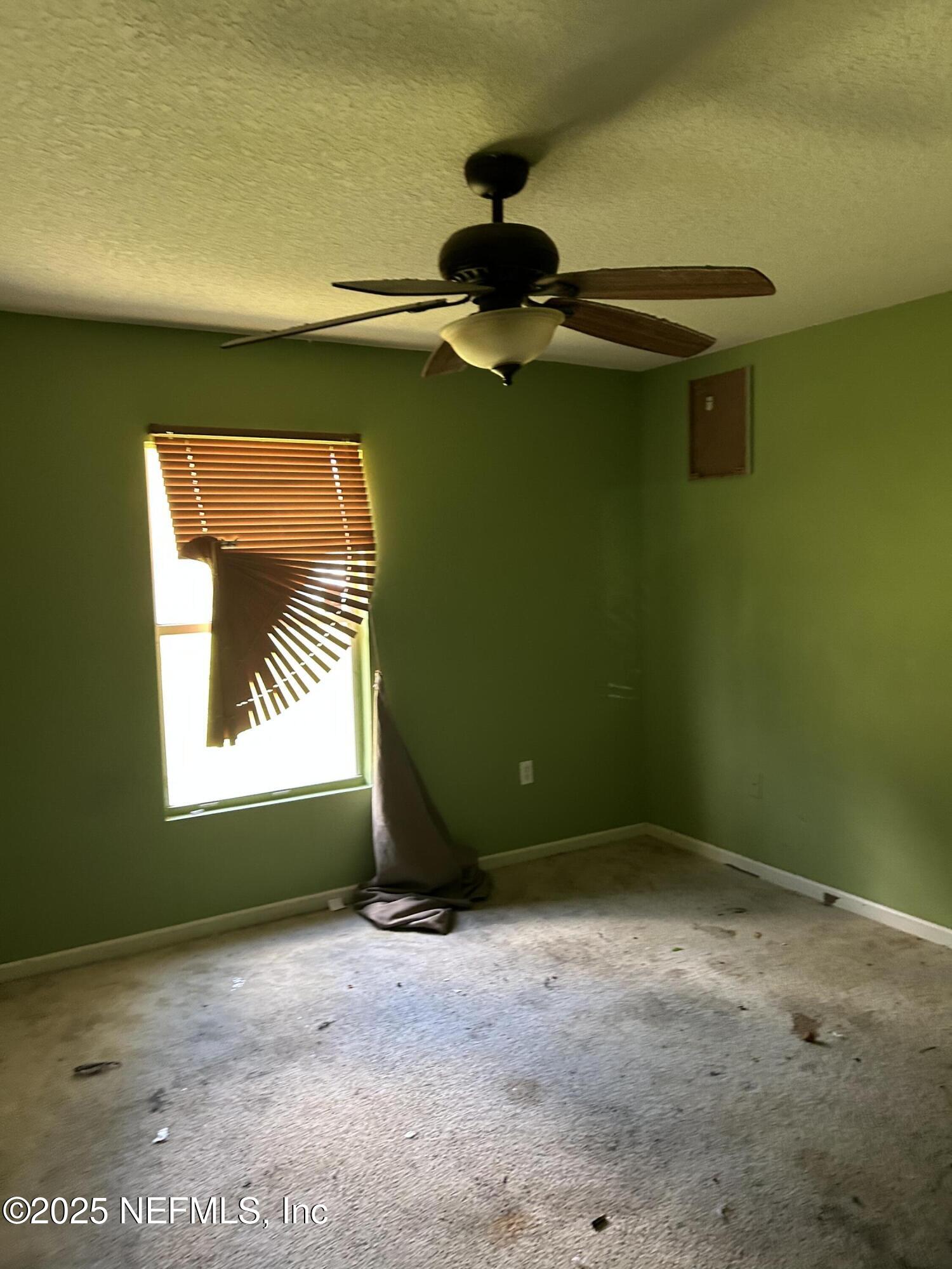 6369 Spring Hollow Court Jacksonville, FL 32218 - Photo 18 of 20 a view of room with window and ceiling fan