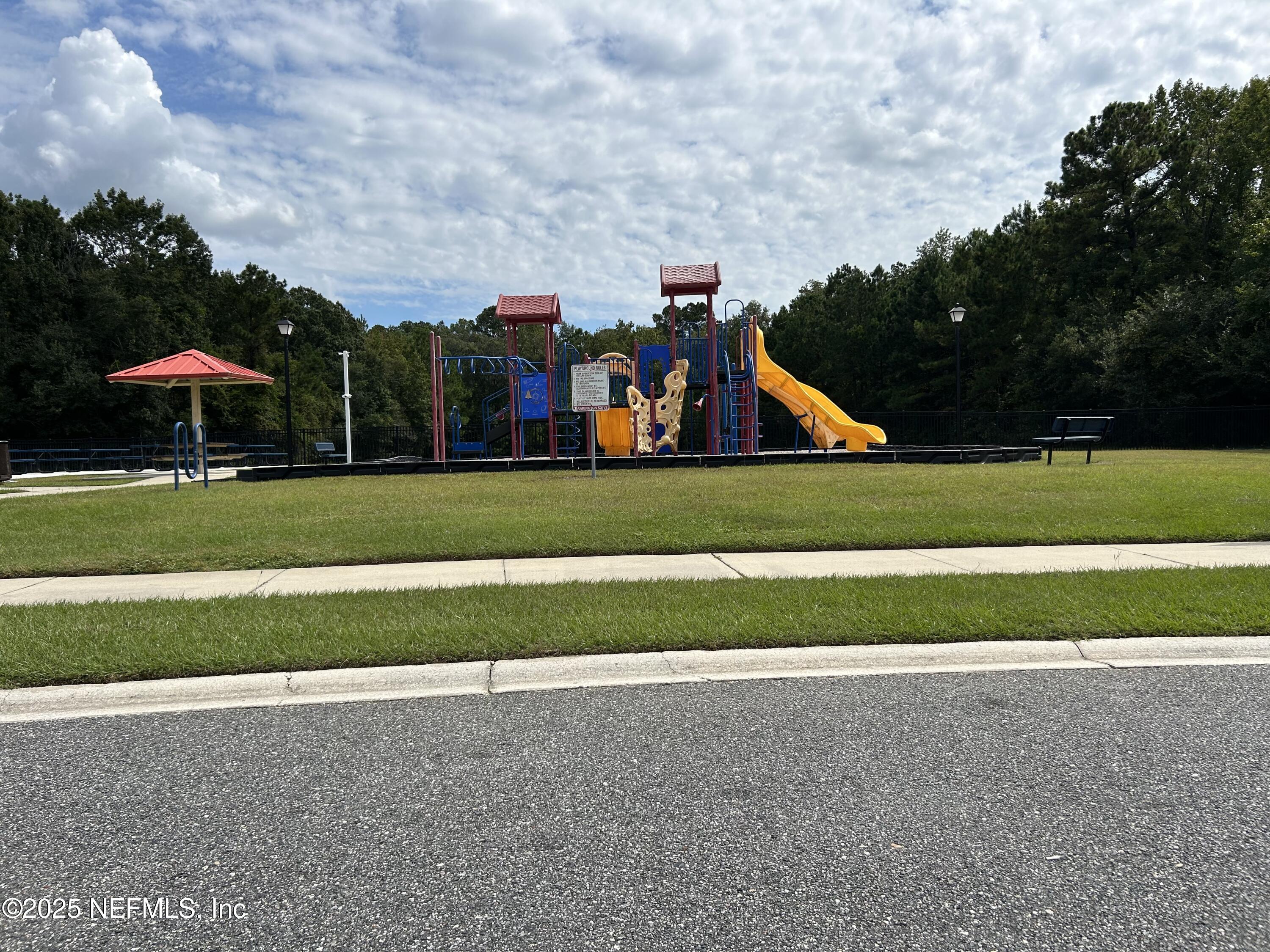 6369 Spring Hollow Court Jacksonville, FL 32218 - Photo 19 of 20 a childrens park with lots of green space and trees