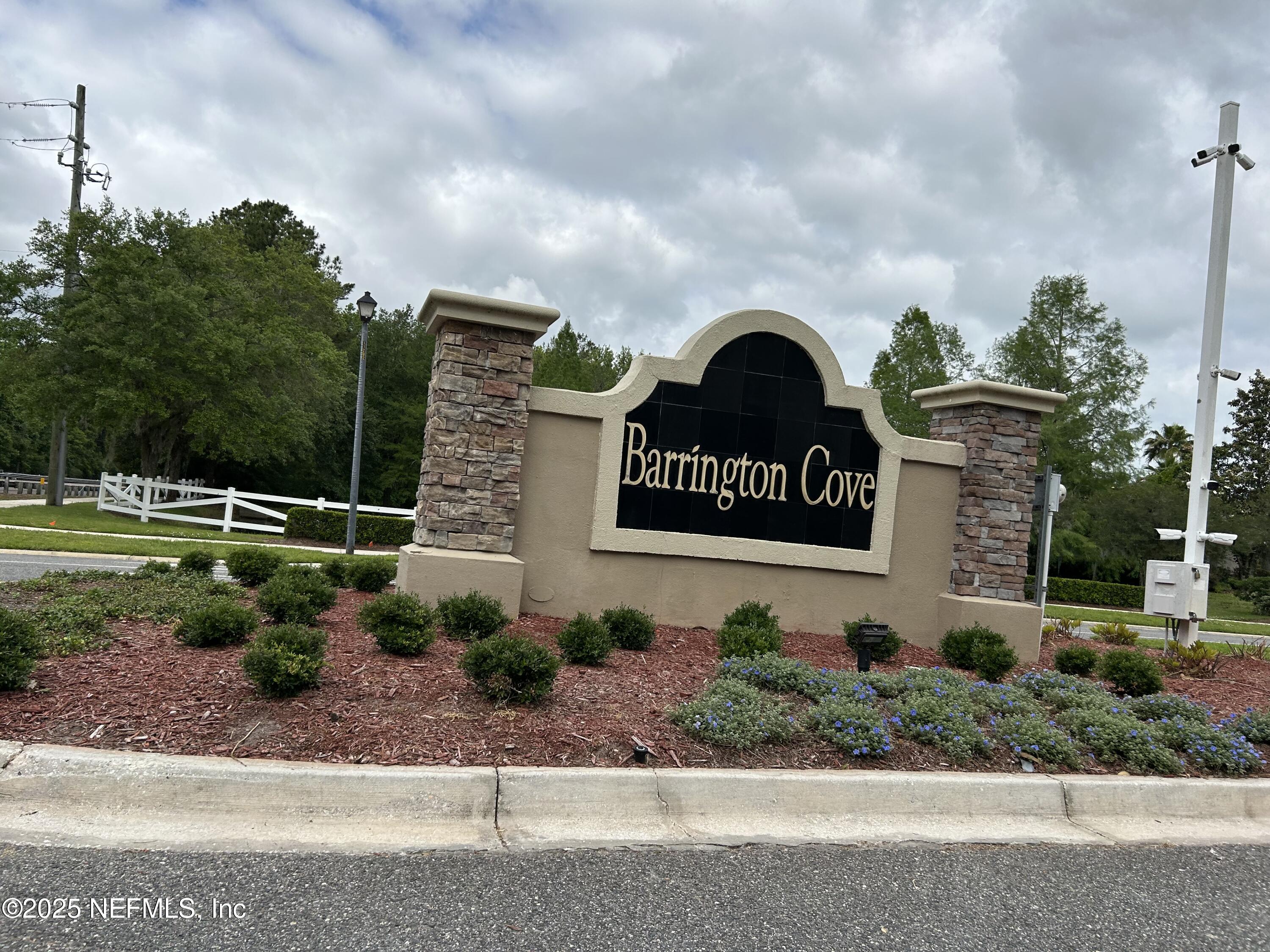 6369 Spring Hollow Court Jacksonville, FL 32218 - Photo 2 of 20 a sign on the side of a road