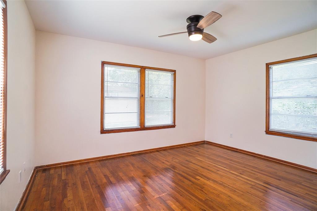 321 West Highway 199 Springtown, TX 76082 - Photo 11 of 22 wooden floor in an empty room with a window