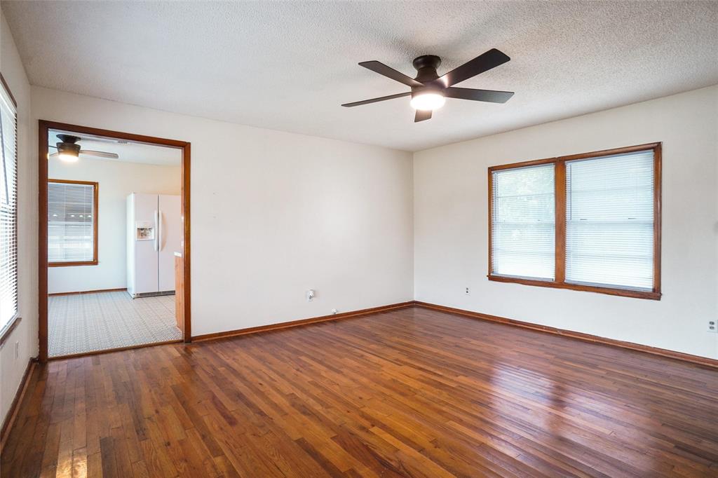 321 West Highway 199 Springtown, TX 76082 - Photo 6 of 22 a view of an empty room with wooden floor and a window