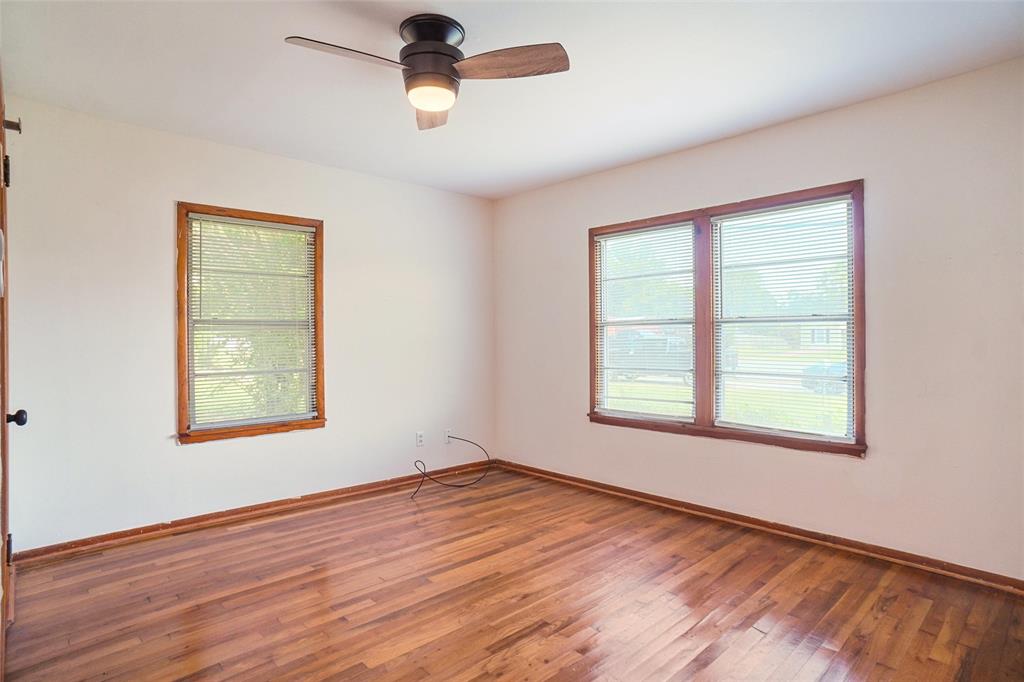 321 West Highway 199 Springtown, TX 76082 - Photo 10 of 22 a view of an empty room with wooden floor and a window