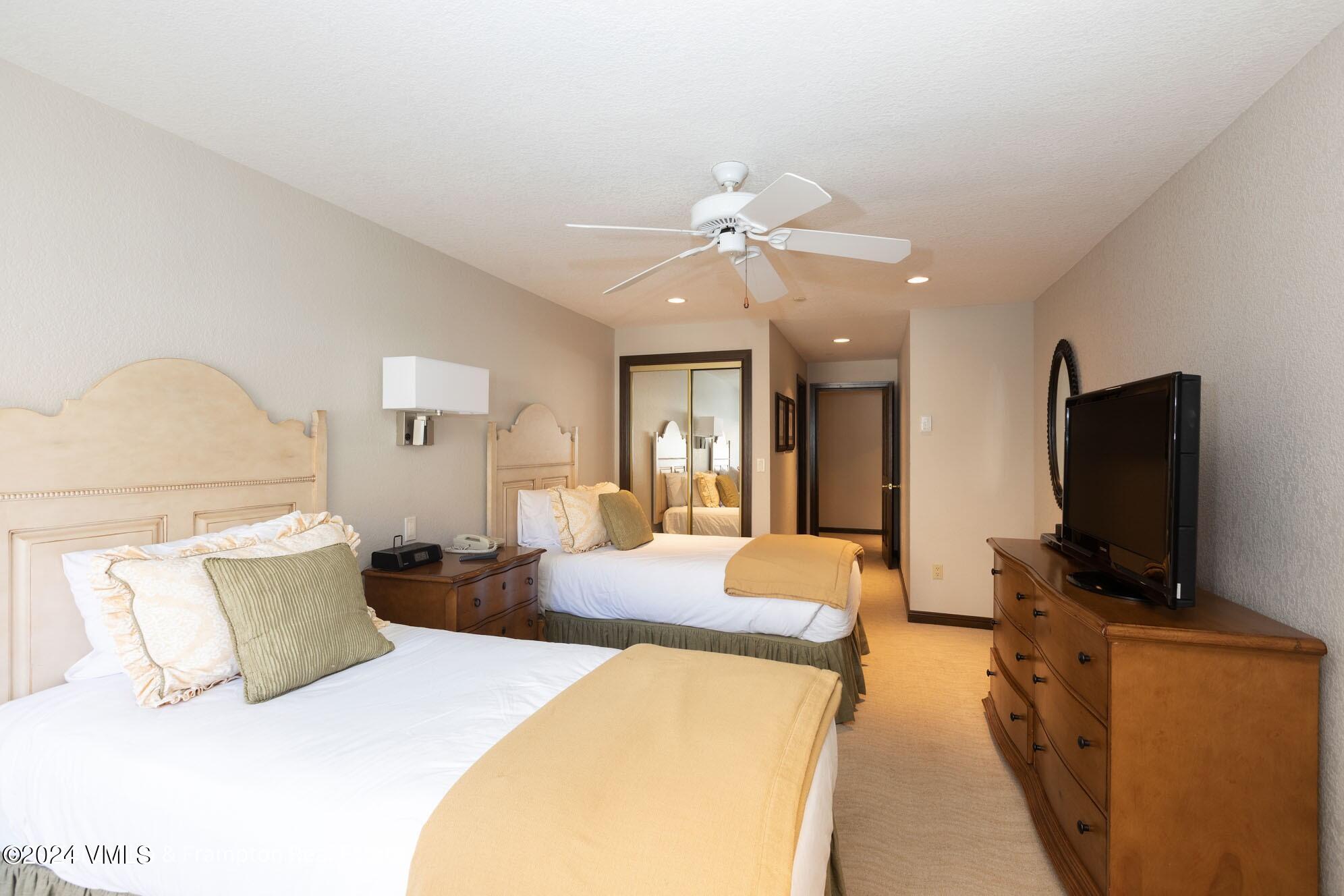 210 Offerson Road, Unit R215 WEEK 47 Beaver Creek, CO 81620 - Photo 19 of 26 a bedroom with a bed and a flat screen tv