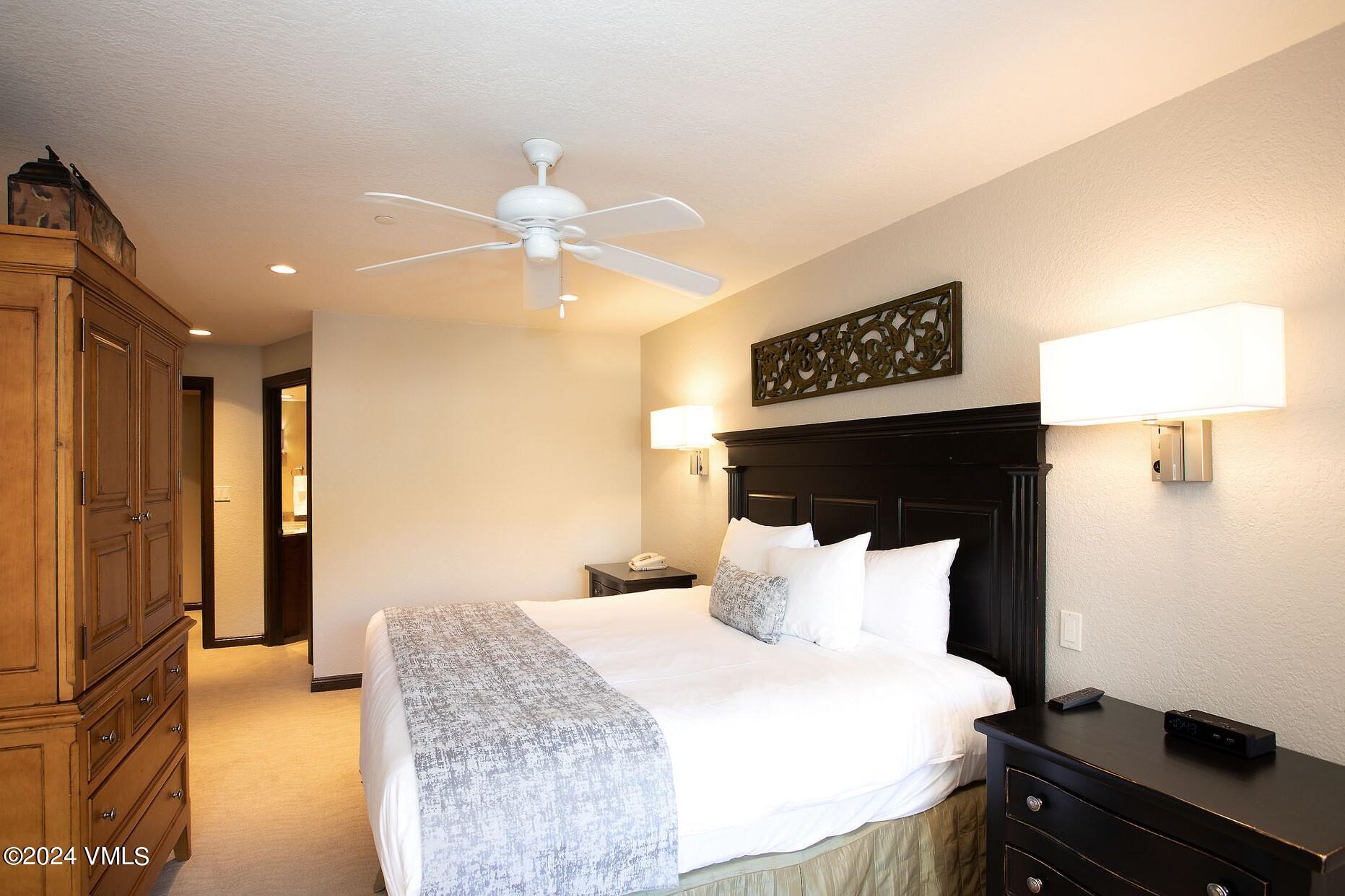 210 Offerson Road, Unit R215 WEEK 47 Beaver Creek, CO 81620 - Photo 23 of 26 a bedroom with a bed and a walk in closet