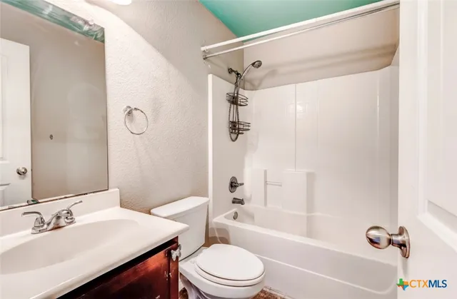 a bathroom with a sink a toilet and a bathtub