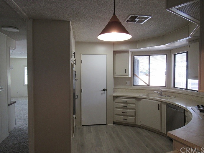 601 North Kirby Street, Unit 557 Hemet, CA 92545 - Photo 3 of 13 a view of a kitchen counter space and windows