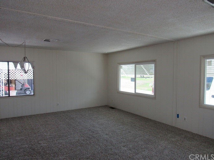 601 North Kirby Street, Unit 557 Hemet, CA 92545 - Photo 5 of 13 an empty room with windows