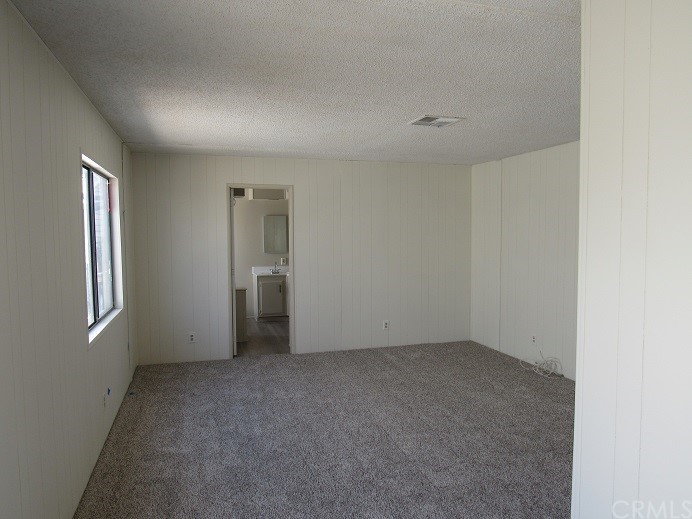 601 North Kirby Street, Unit 557 Hemet, CA 92545 - Photo 8 of 13 an empty room with windows