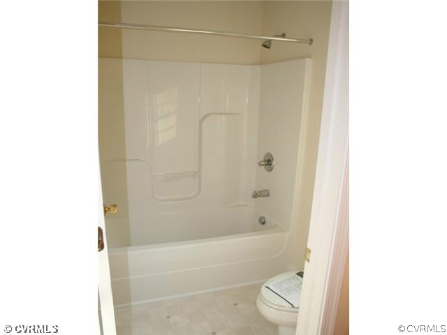 5 Winding Ridge Way Bumpass, VA 23024 - Photo 4 of 10 a bathroom with a bathtub and shower