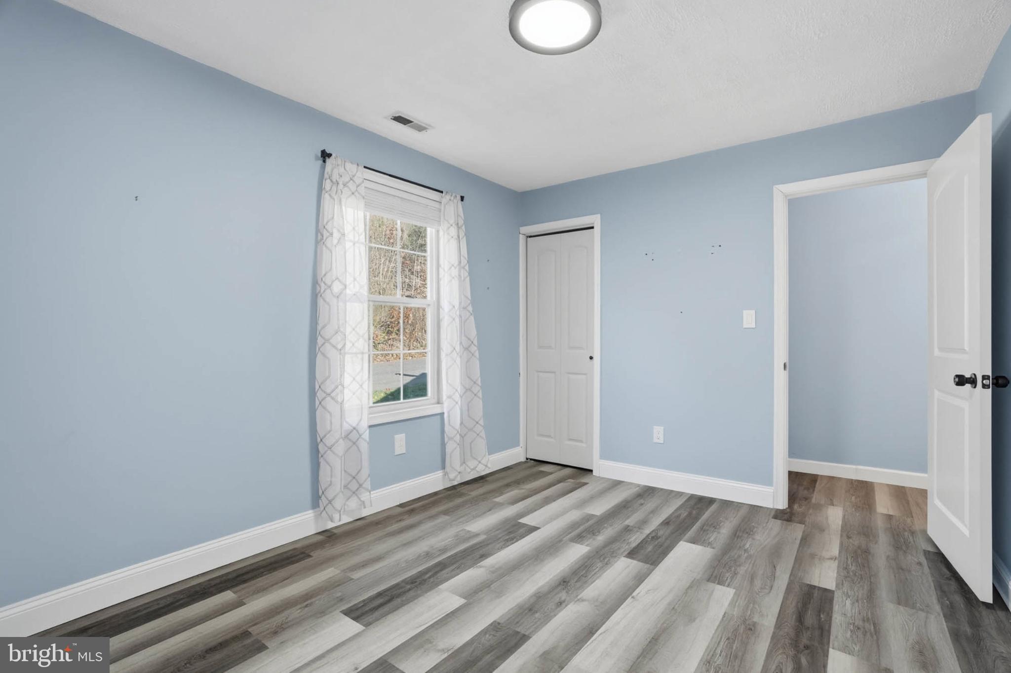 2405 Jerusalem Road Joppa, MD 21085 - Photo 14 of 23 Bright and airy room with serene blue walls.
