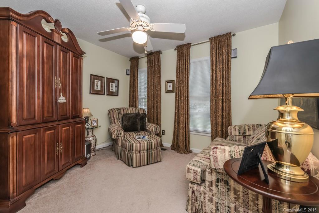 6737 Harrison Road Charlotte, NC 28270 - Photo 12 of 23 a living room with furniture and a chandelier