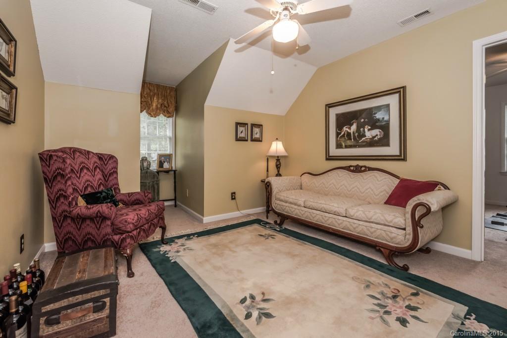 6737 Harrison Road Charlotte, NC 28270 - Photo 14 of 23 a living room with furniture and a rug