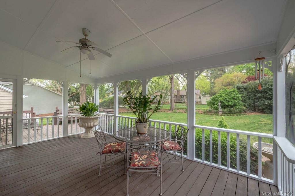 6737 Harrison Road Charlotte, NC 28270 - Photo 20 of 23 a view of a balcony with chairs and wooden floor