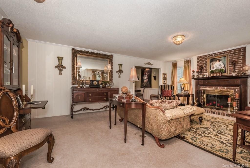 6737 Harrison Road Charlotte, NC 28270 - Photo 3 of 23 a living room with furniture and a fireplace