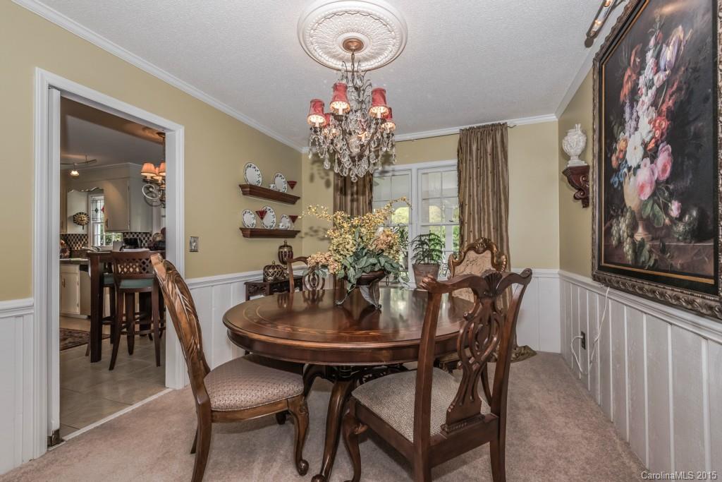 6737 Harrison Road Charlotte, NC 28270 - Photo 5 of 23 a view of a dining room with furniture and chandelier