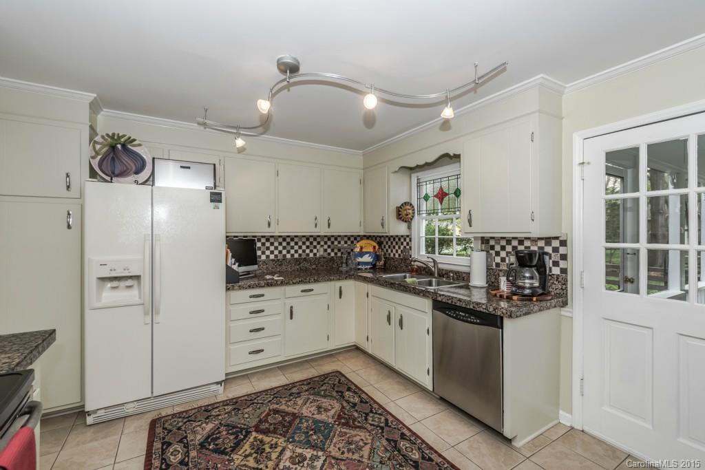 6737 Harrison Road Charlotte, NC 28270 - Photo 8 of 23 a kitchen with stainless steel appliances a sink stove and refrigerator