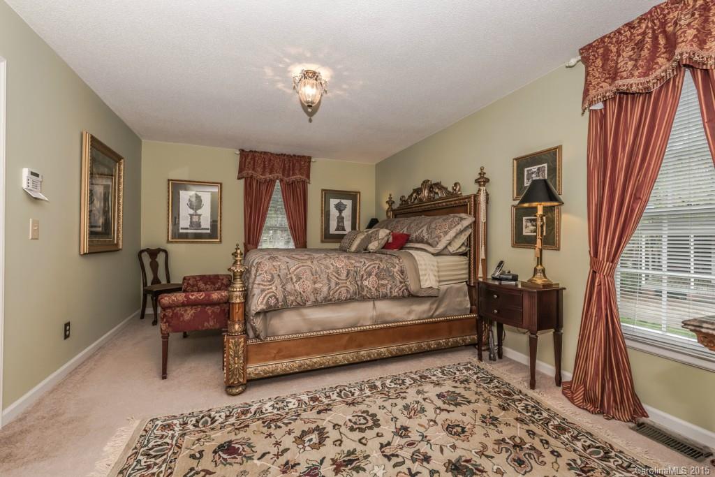 6737 Harrison Road Charlotte, NC 28270 - Photo 9 of 23 a bedroom with a bed and a couch