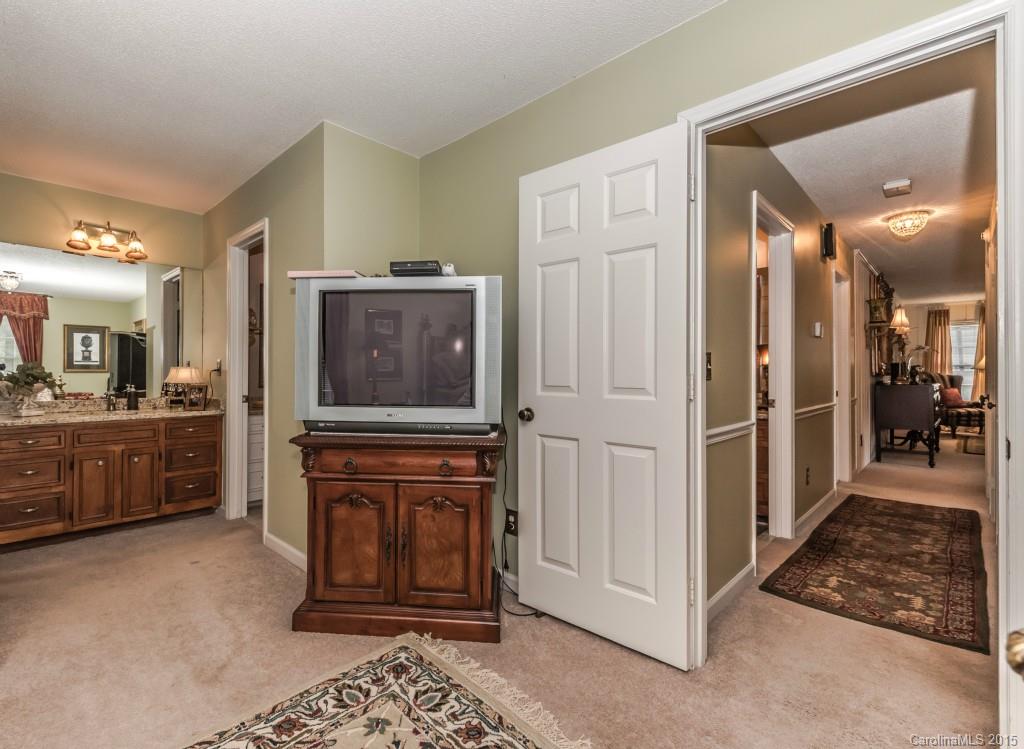 6737 Harrison Road Charlotte, NC 28270 - Photo 10 of 23 a view of a hallway view with living room and bathroom
