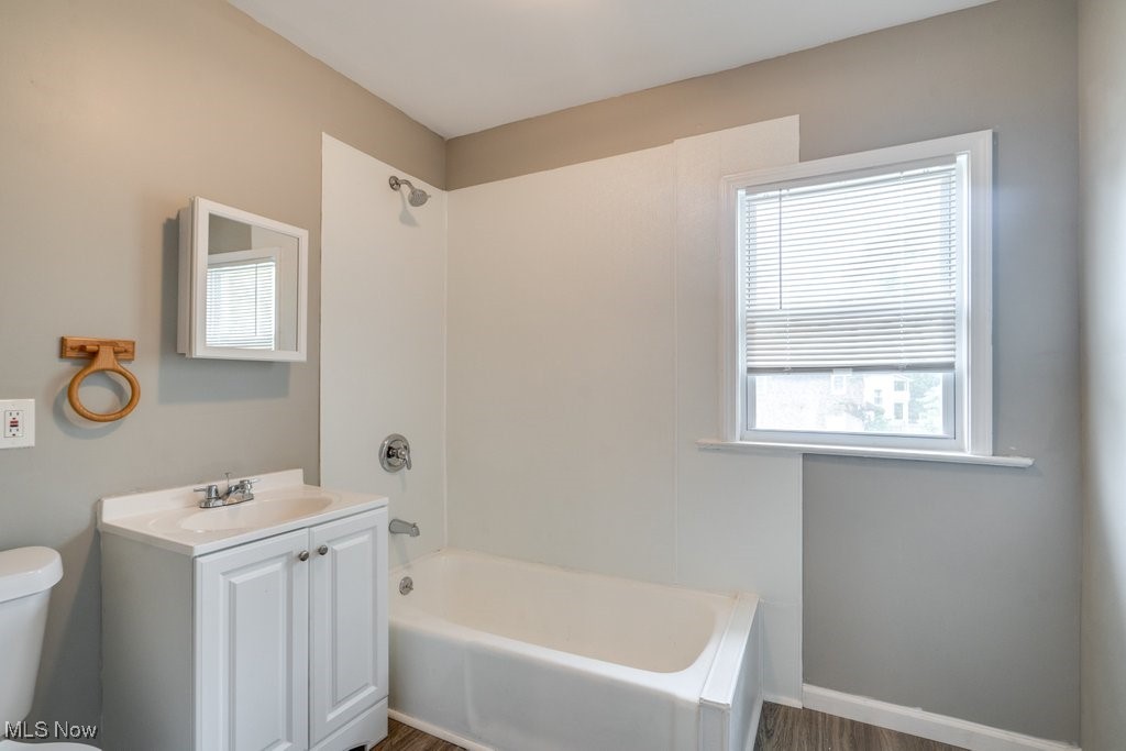 1261 Rozelle Avenue Cleveland, OH 44112 - Photo 21 of 32 Full bathroom with vanity, shower / tub combination, toilet, and plenty of natural light