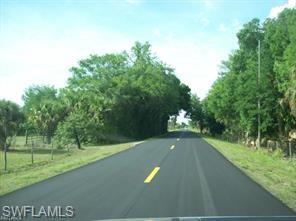 18759 Persimmon Ridge Road Alva, FL 33920 - Photo 13 of 23 a view of a street with a yard