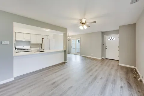 a view of kitchen with wooden floor and window