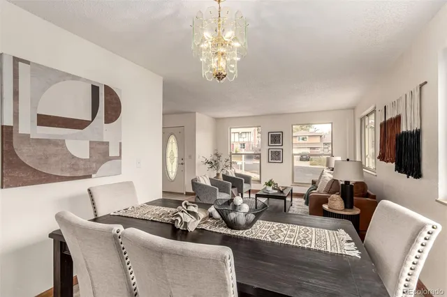 a living room with fireplace furniture and a flat screen tv