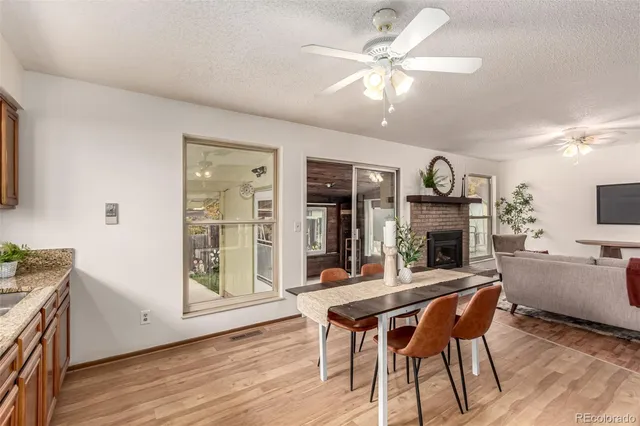 a view of a dining room with furniture window and wooden floor
