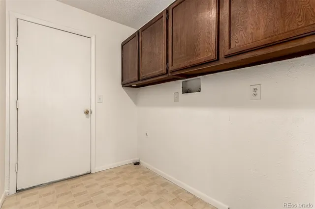 a view of a microwave and cabinets