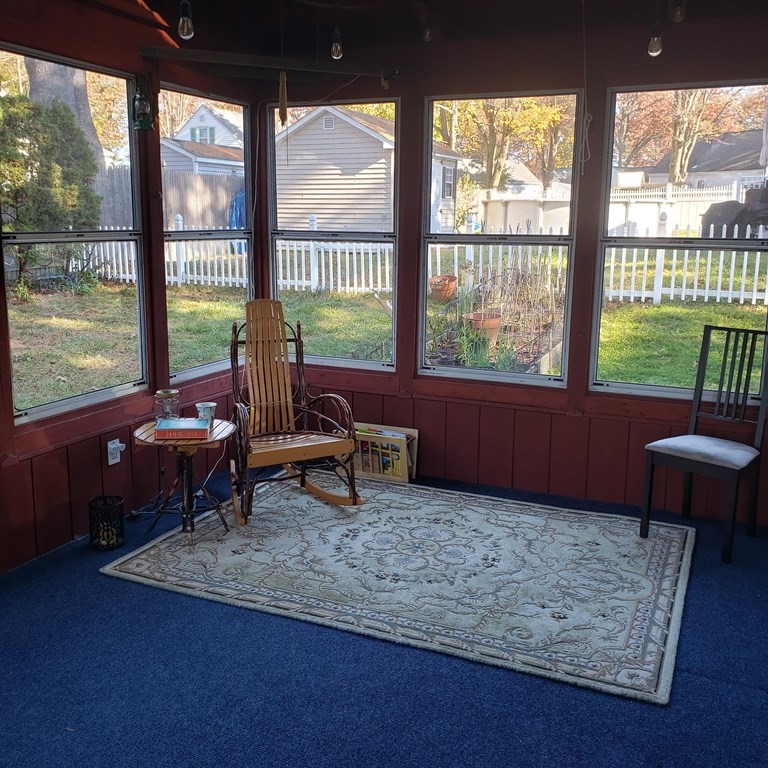 258 Cooper Street Springfield, MA 01108 - Photo 8 of 28 a living room with furniture and a floor to ceiling window